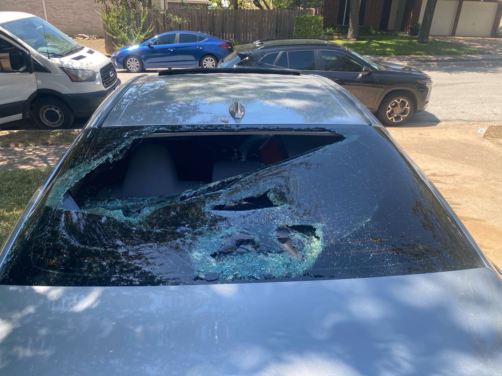 Shattered glass before and after replacement — before